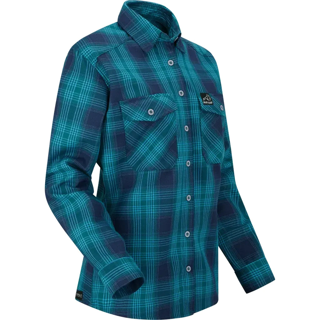 A long-sleeve button-up shirt with a teal and navy blue plaid pattern, featuring two chest pockets and a small embroidered logo patch on the left chest.