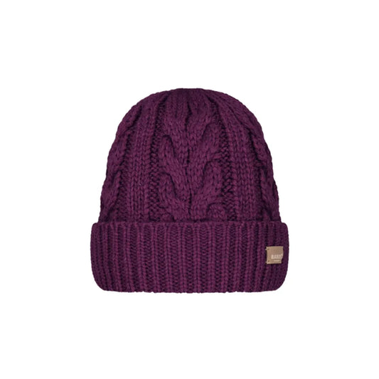 A dark purple cable-knit beanie hat with a ribbed cuff and a small tan square logo patch on the side, shown against a plain white background. Barts Zirani Beanie Aubergine