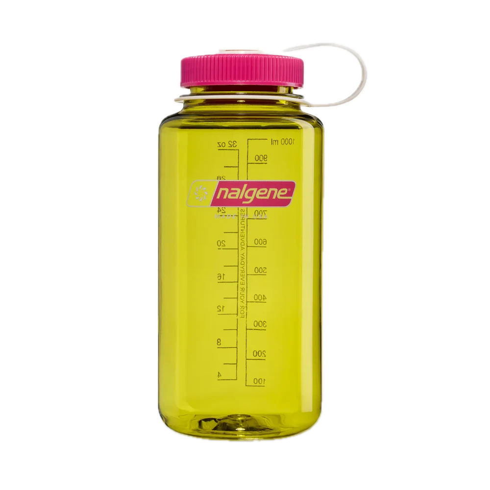 A translucent yellow Nalgene water bottle with a bright pink cap and white carrying loop, shown on a plain white background.